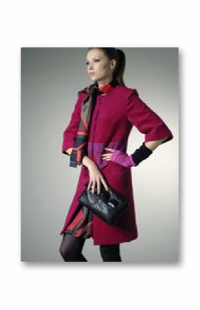 Portrait of a styled professional model holding little purse