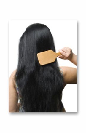 Woman brushing her black long hair