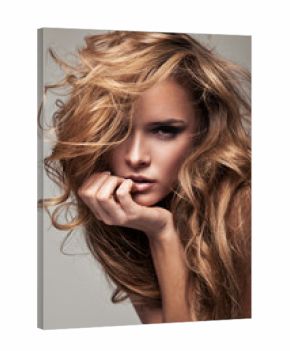 Vogue style portrait of delicate blonde woman