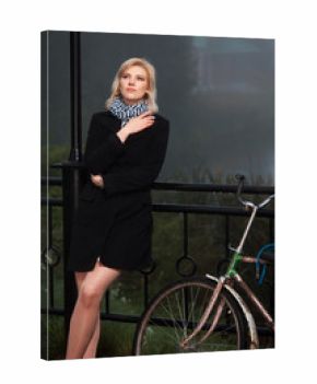 Young woman against a morning foggy landscape