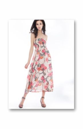 Young pretty woman in elegant light fashion dress, studio shot