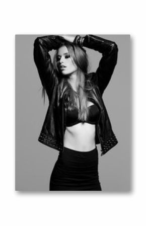 sexy model wearing leather jacket and black skirt posing