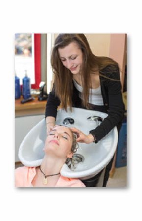 hairstylist washing customers hair