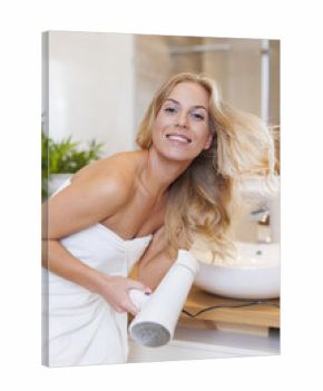 Blonde woman drying hair after the shower