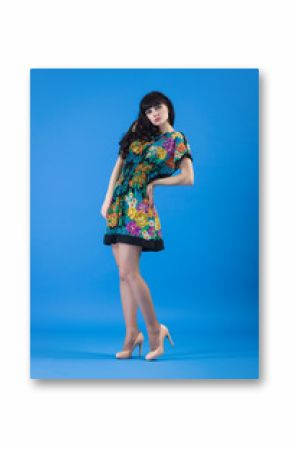 Beautiful young woman in color dress