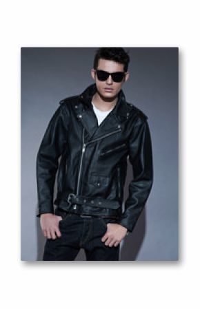 Macho retro rock and roll fifties fashion man with dark grease h