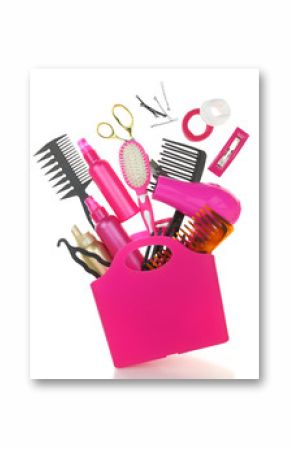 Various hairstyling equipment in shopping bag isolated on white