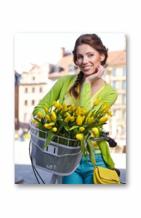Woman wearing a spring skirt like vintage pin-up holding bicycle
