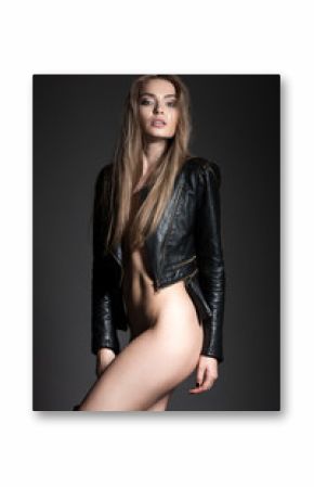 sexy female model, long hair, makeup, leather jacket and boots
