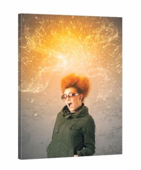 Young woman with energetic exploding red hair