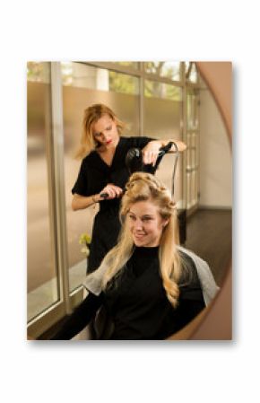 professional hair stylist at work - hairdresser  doing hairstyle