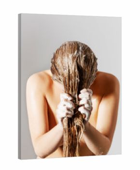 Woman washing her blond hair