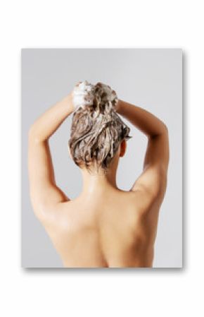 Woman washing her blond hair