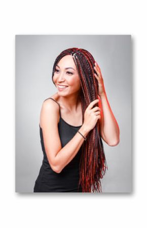 Women Hairstyle with colorful hair extensions braided in thin plaits and afrobraids