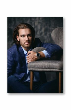 man sitting near armchair
