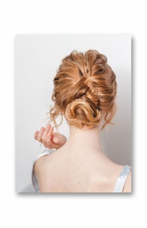 Rear view portrait of attractive young woman with beautiful wedding hairstyle and dress