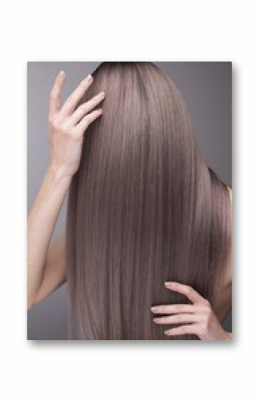 Elegant hands with nude manicure and perfect purple long hair.