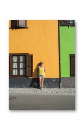 woman walking on foot a mountain village in spring in the Pyrenees