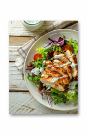 Grilled Chicken Salad with Ranch Dressing on a Wooden Table