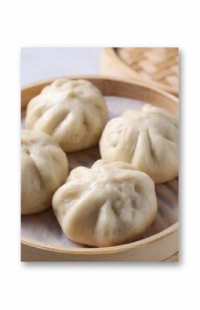 Delicious bao buns (baozi) on light table, closeup
