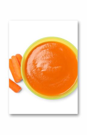 Delicious baby food in bowl and fresh carrots isolated on white, top view
