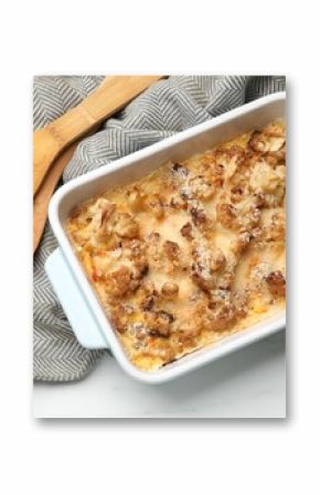 Tasty baked cauliflower in baking dish on white marble table, top view