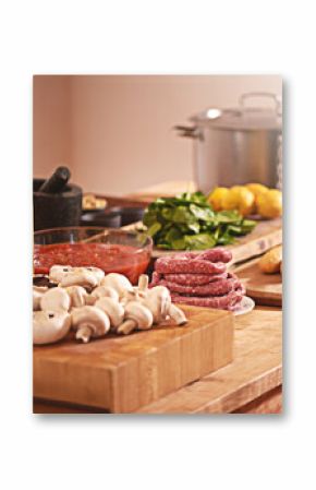 Cooking, Italian food and vegetables in kitchen on table for meal prep for dinner, supper and lunch in home. Recipe, diet and utensils on counter with ingredients for pasta, nutrition and cuisine