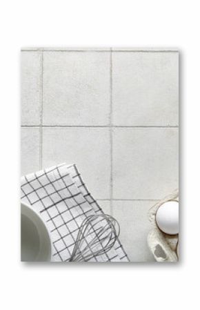 Holder with raw chicken eggs on white tile background