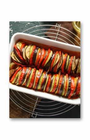 Baking dish of tasty Ratatouille on black background