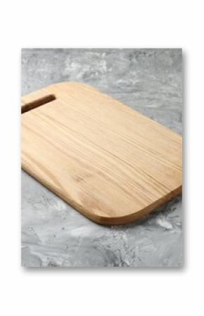 One wooden serving board on light grey textured table, closeup. Space for text