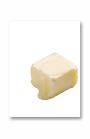 Small cube of pale yellow butter with melting corner pooling softly