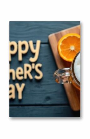 Top-down view of Father Day themed image. Includes beer in glass mug and orange slices on wooden cutting board, along with words Happy Fathers Day. Ideal for greeting cards and holiday promotions.