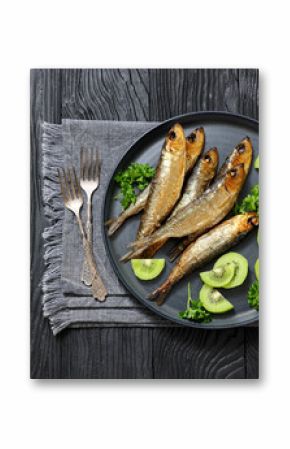 Hot smoked Baltic herrings with kiwi fruit slices