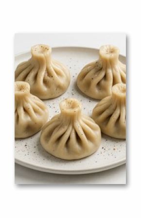 Plate featuring five spicy, flavorful khinkali with enticing aroma