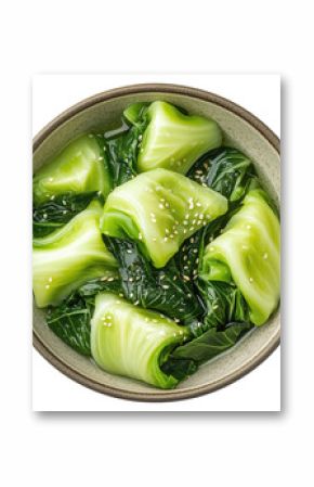Fresh cooked pak choi cabbage in a bowl isolated on transparent background, top view
