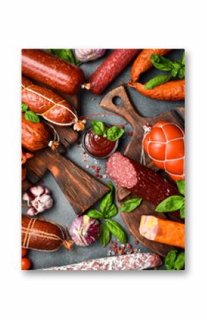 Different types of tasty sausages on grey table, flat lay
