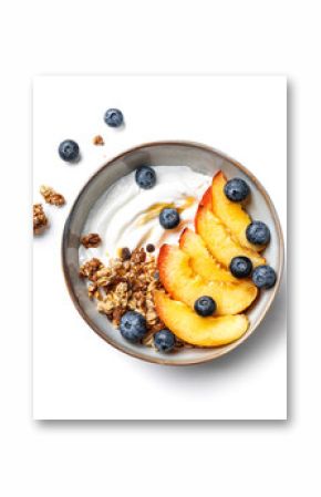 Granola bowl with greek yogurt, peach and blueberries isolated
