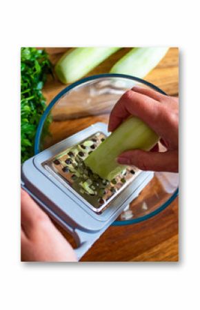 Woman grating fresh cucumber, close-up 