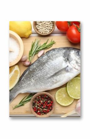 Fresh raw dourade with spices on white wooden table, flat lay. Fish and seafood delicacies