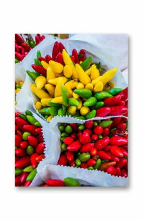 Colorful display of fresh chili peppers in a bustling market in Mexico capturing vibrant local culture and flavors