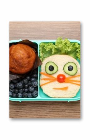Open lunch box with delicious food on wooden table, top view