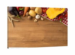 Various vegetables and grains organized neatly on a wooden table as part of a Thanksgiving celebration theme, symbolizing autumn harvest and the blessings of nature, rustic and warm setting