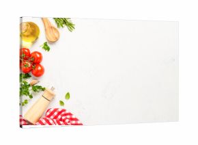 Spices, herbs and vegetables with olive oil on white kitchen table.