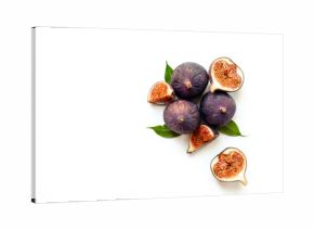 Purple ripe figs fruit and slices with green leaves top view on a white background