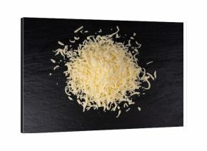Grated mozzarella cheese on black background. Shredded mozarella texture
