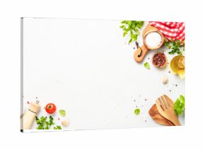 Spices, herbs and vegetables with olive oil on white kitchen table.