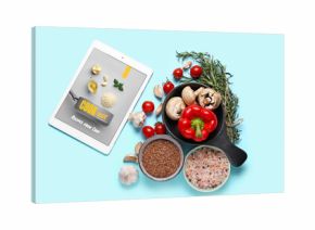 Digital recipe book, vegetables, spices and flax seeds on color background