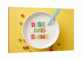 “Rise and Shine” Cereal Letters in Milk Bowl on Yellow Background