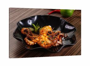 Gourmet grilled whole octopus served lime