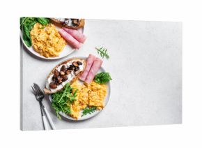 Healthy balanced breakfast with scrambled eggs, sandwich, ham